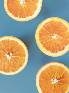 oranges on a blue surface